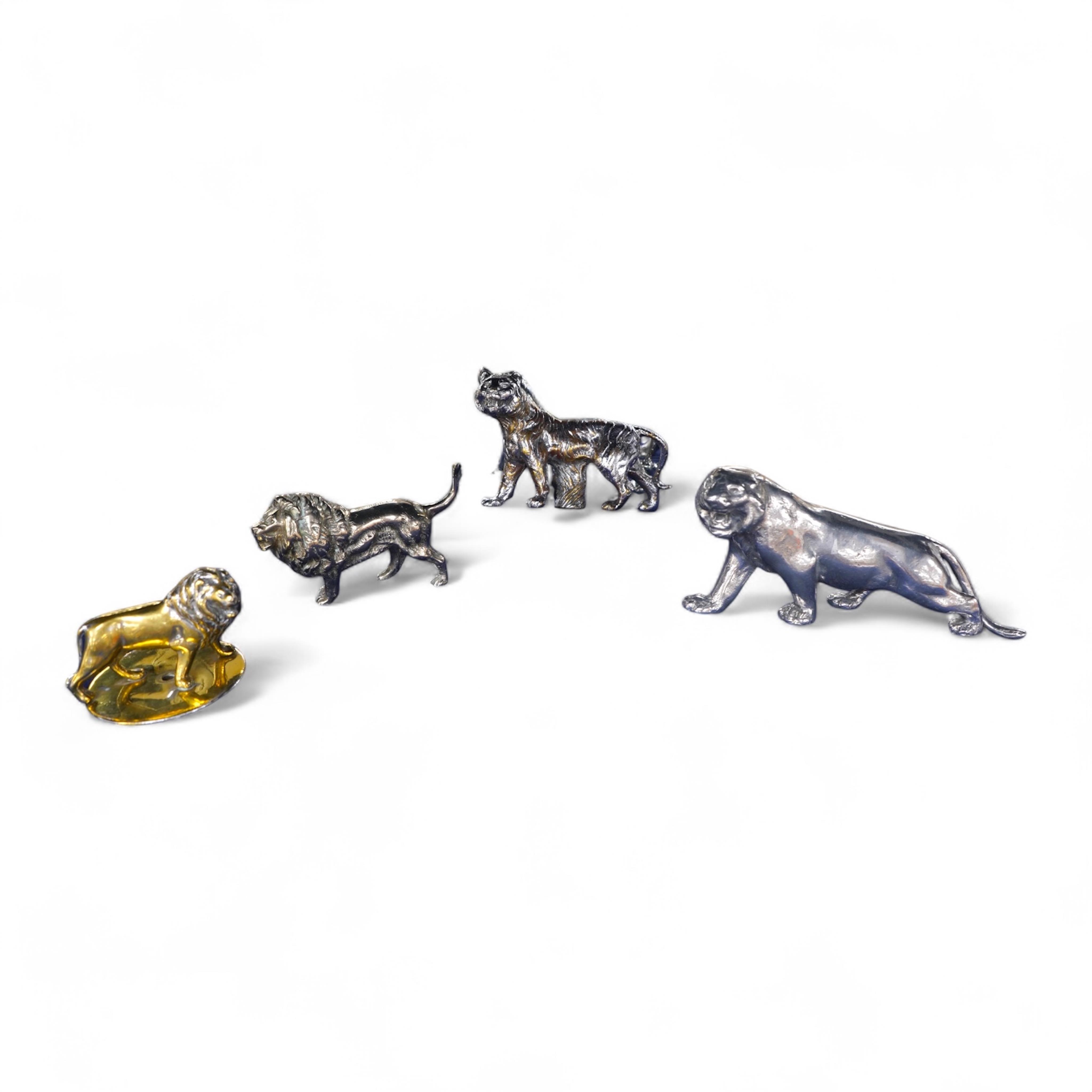 Four lion and big cat related brass and chrome car mascots/figures, consisting of two lions, a tiger and another, possibly a panther. Condition - fair, some losses to chrome.
